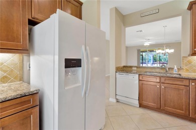 Former Model home.  With a Life in VALENCIA LAKES, one of on Caloosa Greens Executive Golf Course in Florida - for sale on GolfHomes.com, golf home, golf lot