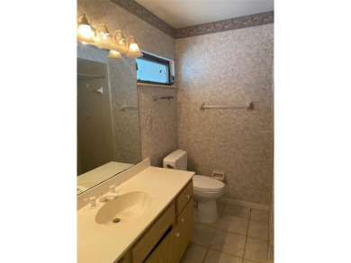 THIS PROPEETY NEEDS UPDATING AND IS BEING SOLD *AS IS*. THE on The Meadows Golf and Country Club in Florida - for sale on GolfHomes.com, golf home, golf lot