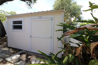 There is so much to love about this beautiful 3 bedroom, 2 bath on The Dunedin Country Club in Florida - for sale on GolfHomes.com, golf home, golf lot