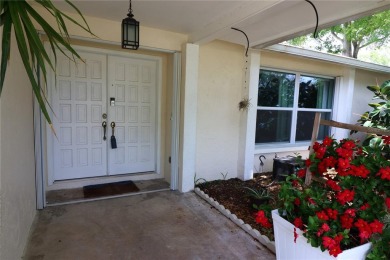 There is so much to love about this beautiful 3 bedroom, 2 bath on The Dunedin Country Club in Florida - for sale on GolfHomes.com, golf home, golf lot