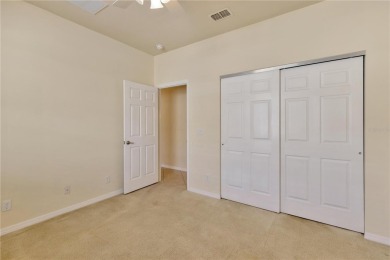 Former Model home.  With a Life in VALENCIA LAKES, one of on Caloosa Greens Executive Golf Course in Florida - for sale on GolfHomes.com, golf home, golf lot