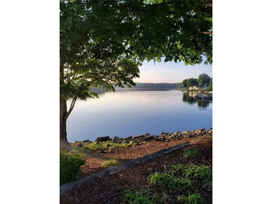 **Downsize without compromise and enjoy easy, lock-and-leave on The Golf Club of Georgia in Georgia - for sale on GolfHomes.com, golf home, golf lot