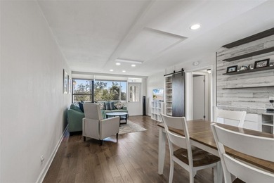 Welcome to this stunning, move-in-ready, FULLY FURNISHED dream on Cove Cay Country Club in Florida - for sale on GolfHomes.com, golf home, golf lot