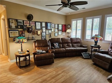 It's the well manicured looking home on a large lot backing the on Hemet Golf Club in California - for sale on GolfHomes.com, golf home, golf lot