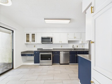 Secluded and beautifully updated, this charming 2-bedroom on Fairway Oaks at Magnolia Golf Course in Florida - for sale on GolfHomes.com, golf home, golf lot