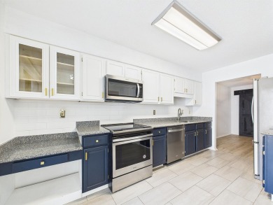 Secluded and beautifully updated, this charming 2-bedroom on Fairway Oaks at Magnolia Golf Course in Florida - for sale on GolfHomes.com, golf home, golf lot