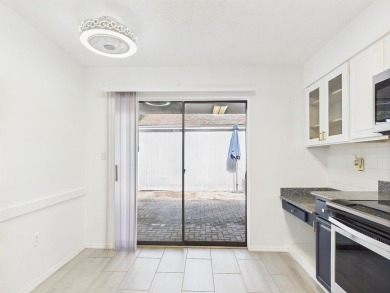 Secluded and beautifully updated, this charming 2-bedroom on Fairway Oaks at Magnolia Golf Course in Florida - for sale on GolfHomes.com, golf home, golf lot