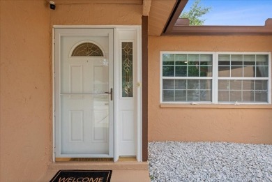 Step into this thoughtfully updated 3-bedroom, 2-bathroom home on Cove Cay Country Club in Florida - for sale on GolfHomes.com, golf home, golf lot