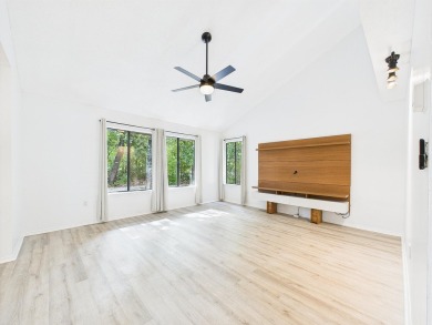 Secluded and beautifully updated, this charming 2-bedroom on Fairway Oaks at Magnolia Golf Course in Florida - for sale on GolfHomes.com, golf home, golf lot
