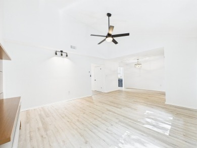 Secluded and beautifully updated, this charming 2-bedroom on Fairway Oaks at Magnolia Golf Course in Florida - for sale on GolfHomes.com, golf home, golf lot