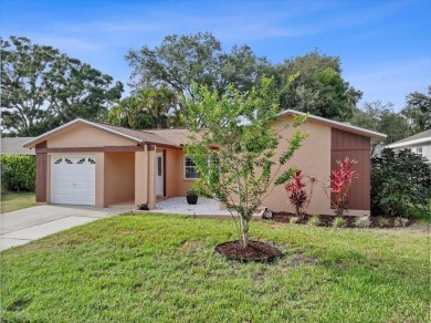 Step into this thoughtfully updated 3-bedroom, 2-bathroom home on Cove Cay Country Club in Florida - for sale on GolfHomes.com, golf home, golf lot