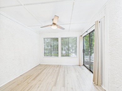 Secluded and beautifully updated, this charming 2-bedroom on Fairway Oaks at Magnolia Golf Course in Florida - for sale on GolfHomes.com, golf home, golf lot