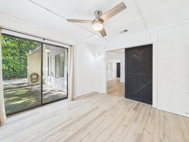 Secluded and beautifully updated, this charming 2-bedroom on Fairway Oaks at Magnolia Golf Course in Florida - for sale on GolfHomes.com, golf home, golf lot