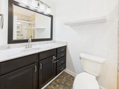 Secluded and beautifully updated, this charming 2-bedroom on Fairway Oaks at Magnolia Golf Course in Florida - for sale on GolfHomes.com, golf home, golf lot