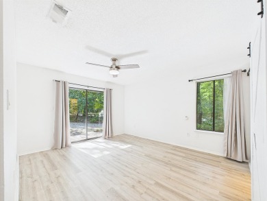 Secluded and beautifully updated, this charming 2-bedroom on Fairway Oaks at Magnolia Golf Course in Florida - for sale on GolfHomes.com, golf home, golf lot