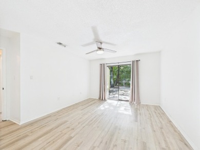 Secluded and beautifully updated, this charming 2-bedroom on Fairway Oaks at Magnolia Golf Course in Florida - for sale on GolfHomes.com, golf home, golf lot
