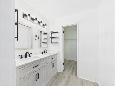 Secluded and beautifully updated, this charming 2-bedroom on Fairway Oaks at Magnolia Golf Course in Florida - for sale on GolfHomes.com, golf home, golf lot