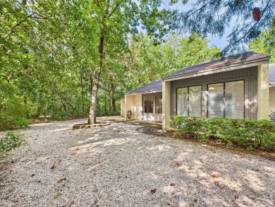 Secluded and beautifully updated, this charming 2-bedroom on Fairway Oaks at Magnolia Golf Course in Florida - for sale on GolfHomes.com, golf home, golf lot
