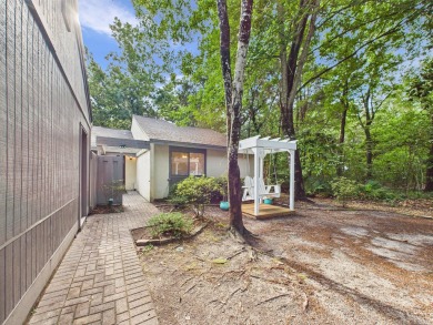 Secluded and beautifully updated, this charming 2-bedroom on Fairway Oaks at Magnolia Golf Course in Florida - for sale on GolfHomes.com, golf home, golf lot