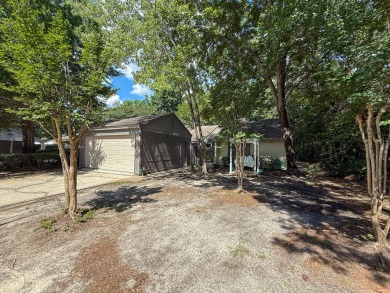 Secluded and beautifully updated, this charming 2-bedroom on Fairway Oaks at Magnolia Golf Course in Florida - for sale on GolfHomes.com, golf home, golf lot