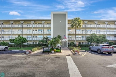 Stunning Corner Unit in Wynmoor! Experience luxurious living in on Wynmoor Golf Course in Florida - for sale on GolfHomes.com, golf home, golf lot