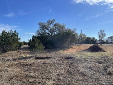 Beautiful level lot located in Rockin' J Ranch that backs up to on Vaaler Creek Golf Club in Texas - for sale on GolfHomes.com, golf home, golf lot