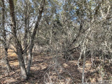 Beautiful level lot located in Rockin' J Ranch that backs up to on Vaaler Creek Golf Club in Texas - for sale on GolfHomes.com, golf home, golf lot