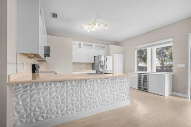 Stunning 4-bedroom, 3-bath home in the serene, gated Augusta on Keys Gate Golf Club in Florida - for sale on GolfHomes.com, golf home, golf lot