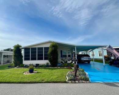 Delightful and meticulously maintained home, partially furnished on Lake Henry Golf Club in Florida - for sale on GolfHomes.com, golf home, golf lot