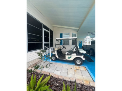 Delightful and meticulously maintained home, partially furnished on Lake Henry Golf Club in Florida - for sale on GolfHomes.com, golf home, golf lot