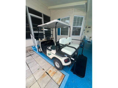 Delightful and meticulously maintained home, partially furnished on Lake Henry Golf Club in Florida - for sale on GolfHomes.com, golf home, golf lot