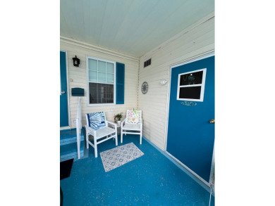 Delightful and meticulously maintained home, partially furnished on Lake Henry Golf Club in Florida - for sale on GolfHomes.com, golf home, golf lot