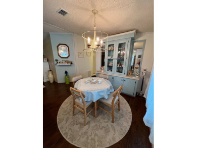 Delightful and meticulously maintained home, partially furnished on Lake Henry Golf Club in Florida - for sale on GolfHomes.com, golf home, golf lot