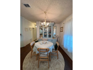 Delightful and meticulously maintained home, partially furnished on Lake Henry Golf Club in Florida - for sale on GolfHomes.com, golf home, golf lot