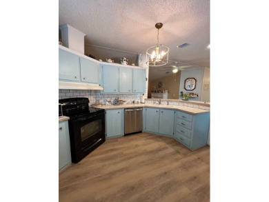 Delightful and meticulously maintained home, partially furnished on Lake Henry Golf Club in Florida - for sale on GolfHomes.com, golf home, golf lot