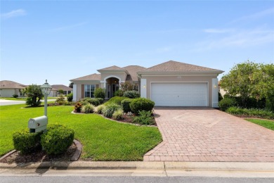 This elegant SANTA ROSA home sits proudly on a corner lot of a on Eagle Ridge At Spruce Creek Country Club in Florida - for sale on GolfHomes.com, golf home, golf lot