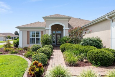 This elegant SANTA ROSA home sits proudly on a corner lot of a on Eagle Ridge At Spruce Creek Country Club in Florida - for sale on GolfHomes.com, golf home, golf lot
