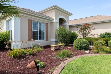 This elegant SANTA ROSA home sits proudly on a corner lot of a on Eagle Ridge At Spruce Creek Country Club in Florida - for sale on GolfHomes.com, golf home, golf lot