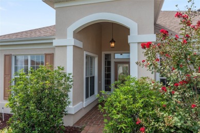 This elegant SANTA ROSA home sits proudly on a corner lot of a on Eagle Ridge At Spruce Creek Country Club in Florida - for sale on GolfHomes.com, golf home, golf lot