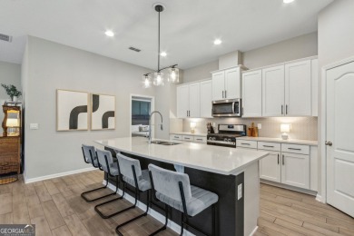 Welcome to 310 Chinquapin Drive, where designer style meets on The Club At Osprey Cove in Georgia - for sale on GolfHomes.com, golf home, golf lot