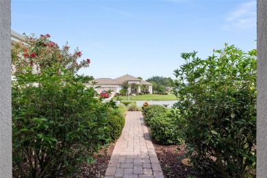 This elegant SANTA ROSA home sits proudly on a corner lot of a on Eagle Ridge At Spruce Creek Country Club in Florida - for sale on GolfHomes.com, golf home, golf lot