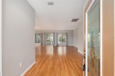This elegant SANTA ROSA home sits proudly on a corner lot of a on Eagle Ridge At Spruce Creek Country Club in Florida - for sale on GolfHomes.com, golf home, golf lot