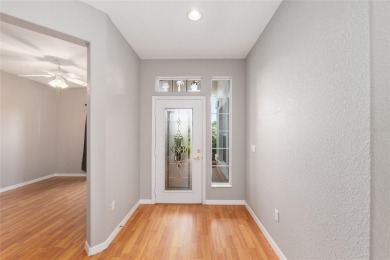 This elegant SANTA ROSA home sits proudly on a corner lot of a on Eagle Ridge At Spruce Creek Country Club in Florida - for sale on GolfHomes.com, golf home, golf lot