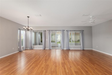 This elegant SANTA ROSA home sits proudly on a corner lot of a on Eagle Ridge At Spruce Creek Country Club in Florida - for sale on GolfHomes.com, golf home, golf lot