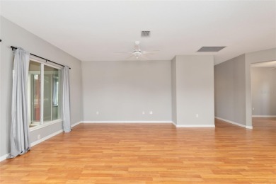 This elegant SANTA ROSA home sits proudly on a corner lot of a on Eagle Ridge At Spruce Creek Country Club in Florida - for sale on GolfHomes.com, golf home, golf lot