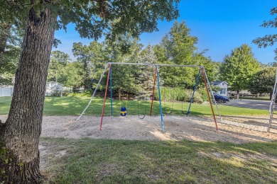 Ready to relax & enjoy yourself. This charming 2004 cottage on Marquette Trails Country Club in Michigan - for sale on GolfHomes.com, golf home, golf lot