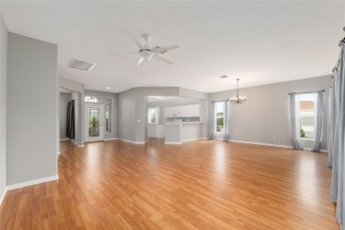 This elegant SANTA ROSA home sits proudly on a corner lot of a on Eagle Ridge At Spruce Creek Country Club in Florida - for sale on GolfHomes.com, golf home, golf lot