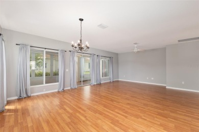 This elegant SANTA ROSA home sits proudly on a corner lot of a on Eagle Ridge At Spruce Creek Country Club in Florida - for sale on GolfHomes.com, golf home, golf lot