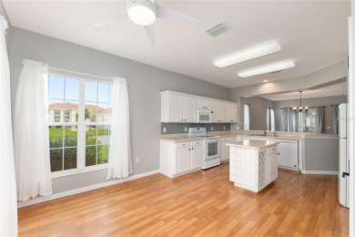 This elegant SANTA ROSA home sits proudly on a corner lot of a on Eagle Ridge At Spruce Creek Country Club in Florida - for sale on GolfHomes.com, golf home, golf lot