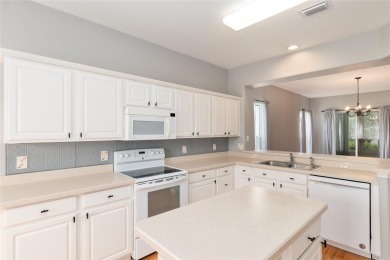 This elegant SANTA ROSA home sits proudly on a corner lot of a on Eagle Ridge At Spruce Creek Country Club in Florida - for sale on GolfHomes.com, golf home, golf lot